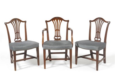 Lot 1664 - A Set of Eight George III Mahogany Dining Chairs, early 19th century, with anthemion carved top...