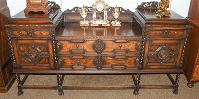 Lot 1133 - A George V oak twin pedestal sideboard, ornamental with fretwork, with barley twist supports...