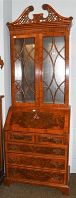 Lot 1141 - A 20th century yew wood and mahogany bureau bookcase of slender proportions, with an openwork...