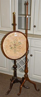 Lot 1148 - A Georgian mahogany pole screen with silk panel (a.f) together with a pole screen stand lacking...