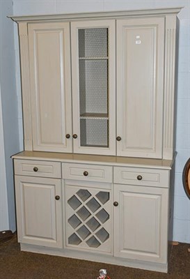 Lot 1149 - A modern painted house keepers cupboard, with reeded supports and incorporating a wine rack,...
