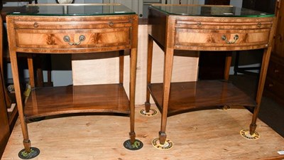 Lot 1155 - A pair of crossbanded mahogany bow front bedside tables, each with a single drawer, a slide and...
