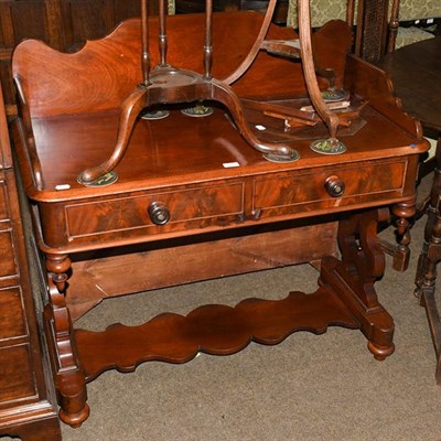 Lot 1175 - A Victorian mahogany washstand with splash back and two drawers, raised on twin lyre supports,...