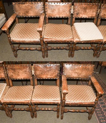 Lot 1194 - A set of six early 20th century oak studded leather upholstered dining chairs, including a pair...
