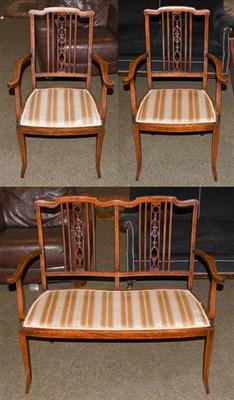 Lot 1196 - An early 20th century mahogany three part parlour suite, with strung inlay raised on square...