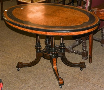 Lot 1198 - A Victorian burr walnut loo table with ebonised and parcel gilt moulding, 118cm by 86cm by 72cm