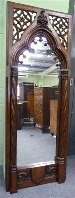 Lot 1674 - A Victorian Oak Gothic Revival Mirror, late 19th century, the arched plate flanked by spiral turned