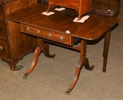 Lot 1211 - A 20th century small mahogany sofa table with two deep leaves, standing on curved legs and...