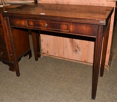 Lot 1218 - A George III mahogany tea table with single drawer and reeded square supports, 91cm by 45cm by 73cm
