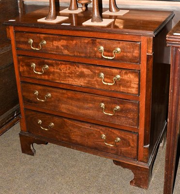 Lot 1219 - A 19th century mahogany four height chest of drawers of small proportions, with canted corners...