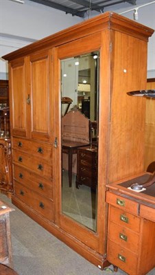 Lot 1225 - A Victorian walnut compactum wardrobe, with mirrored door incorporating a chest and linen...