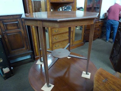 Lot 1228 - A Victorian mahogany octagonal window table, crossbanded with strung inlay and raised on square...
