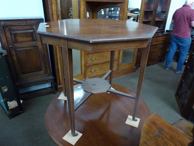 Lot 1228 - A Victorian mahogany octagonal window table, crossbanded with strung inlay and raised on square...
