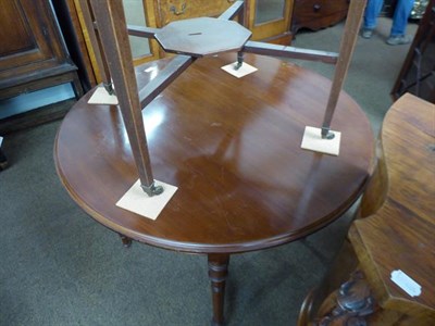 Lot 1228 - A Victorian mahogany octagonal window table, crossbanded with strung inlay and raised on square...