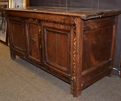Lot 1229 - An 18th century parquetry inlaid three panel oak marriage chest, 124cm by 49cm by 63cm
