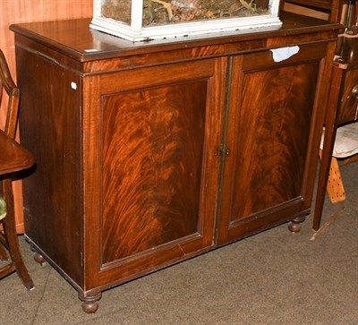 Lot 1235 - An early 19th century mahogany two door side cabinet, 125cm by 52cm by 102cm