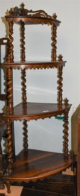 Lot 1240 - A Victorian rosewood four tier corner whatnot stand, with open fretwork carving raised on...