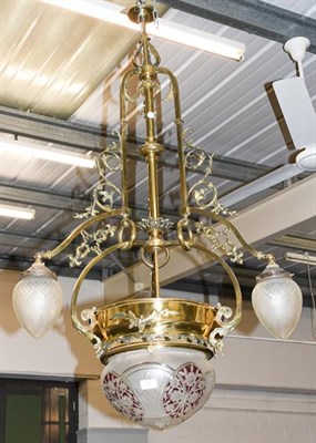 Lot 1261 - A brass ceiling centre light, 19th century, with scrolling brass branches with decorative...