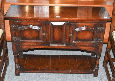 Lot 1292 - A reproduction oak two door small sideboard, 100cm by 32cm by 74cm