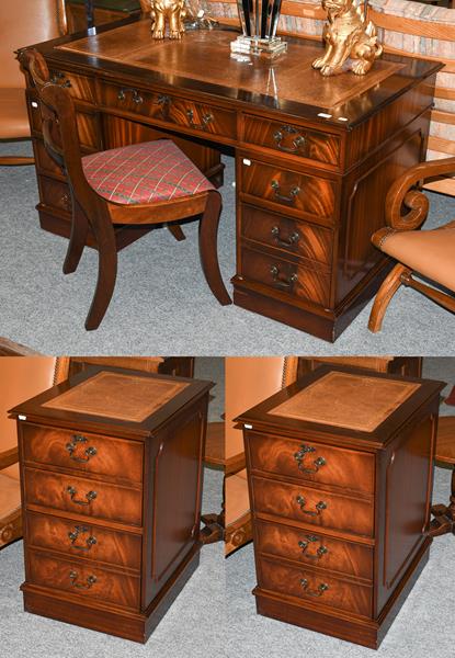 Lot 1302 - A reproduction mahogany leather inset twin pedestal desk with matching filing cabinet, together...