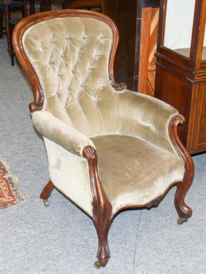 Lot 1310 - A Victorian mahogany spoon back chair, upholstered in green button-back fabric on carved...
