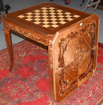 Lot 1315 - A 20th century Italian marquetry games table, incorporating tables for backgammon, chess, and...