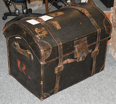 Lot 1318 - A 19th century dome top canvas and leather bound trunk with straps, 78cm by 55cm by 62cm