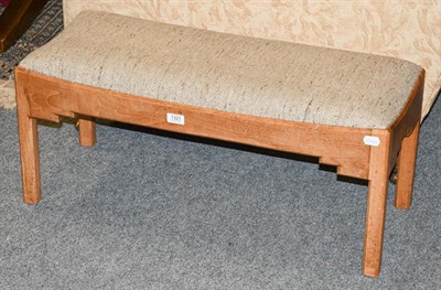 Lot 1321 - A 20th century blonde mahogany long footstool, raised on chamfered square supports, 82cm by 32cm by