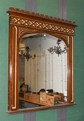 Lot 1326 - An oak parcel gilt over mantle mirror in the Gothic taste, 134cm by 156cm