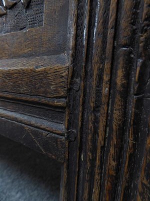 Lot 1339 - A 17th century oak coffer monogrammed M.L and dated 1682 (a.f.), 126cm by 57cm by 75cm