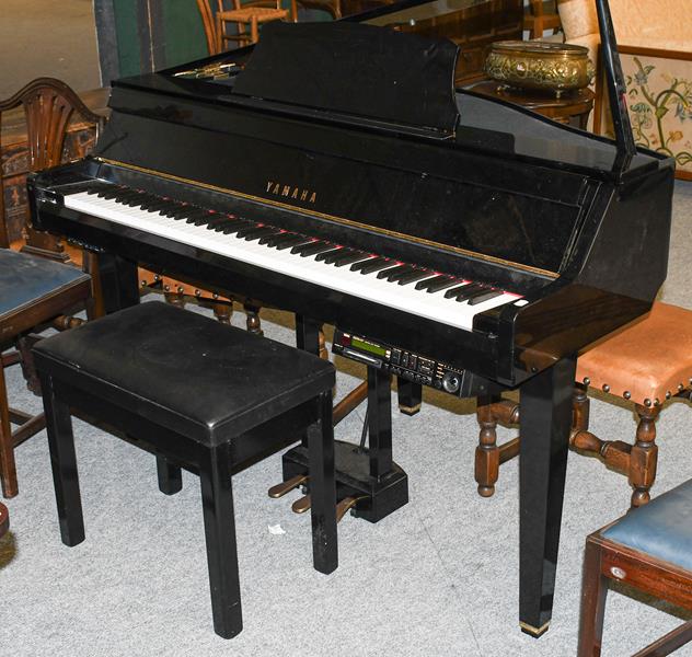 Lot 1342 - A Yamaha disc playing baby grand piano