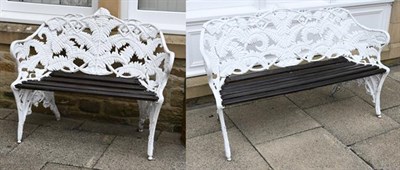 Lot 1346 - A matched pair of white painted aluminium fern pattern garden benches after Coalbrookdale, a...