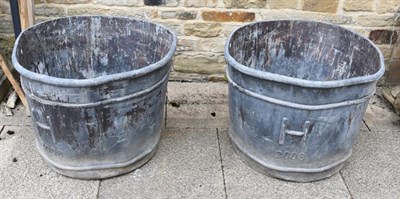 Lot 1348 - A large pair of lead garden planters of bucket form, monogrammed H and dated 2008,...