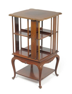 Lot 1689 - An Edwardian Mahogany and Boxwood Strung Revolving Bookcase, early 20th century, the moulded...