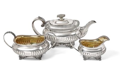 Lot 2017 - A Three-Piece George III and George IV Silver Tea-Service, The Teapot Maker's Mark Worn,...
