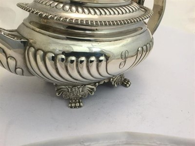 Lot 2017 - A Three-Piece George III and George IV Silver Tea-Service, The Teapot Maker's Mark Worn,...