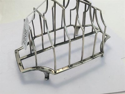 Lot 2022 - A George III Silver Toast-Rack, by Michael Plummer, London, 1792, shaped oblong and on four...
