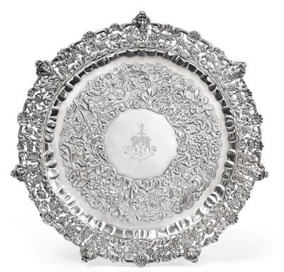 Lot 2024 - A William IV Irish Silver Salver, by James Moore, Dublin, 1835, shaped circular and on four foliage