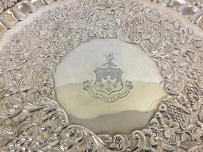 Lot 2024 - A William IV Irish Silver Salver, by James Moore, Dublin, 1835, shaped circular and on four foliage