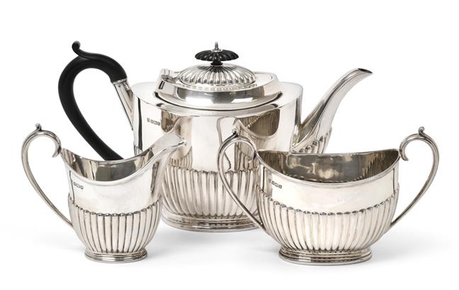 Lot 2065 - A Three-Piece Edward VII Silver Tea-Service, by Cooper Brothers and Sons Ltd., Sheffield, 1908,...