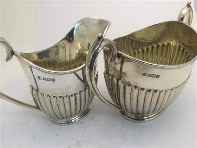 Lot 2065 - A Three-Piece Edward VII Silver Tea-Service, by Cooper Brothers and Sons Ltd., Sheffield, 1908,...