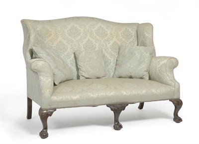 Lot 1700 - A Victorian Wing Back Settee, late 19th century, upholstered in light blue floral silk fabric...