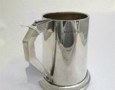 Lot 2086 - A George V Silver Mug, by Hukin and Heath Ltd., Birmingham, 1935, tapering cylindrical and on...