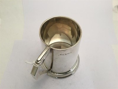 Lot 2086 - A George V Silver Mug, by Hukin and Heath Ltd., Birmingham, 1935, tapering cylindrical and on...