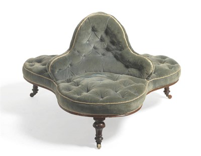 Lot 1702 - A Victorian Walnut Framed Conversation Settee, circa 1850, upholstered in blue button velvet,...