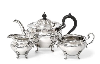 Lot 2101 - A Three-Piece Edward VII Scottish Silver Tea-Service, by Hamilton and Inches, Edinburgh, 1908, each