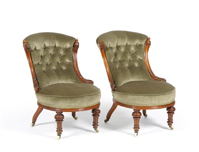 Lot 1704 - A Pair of Victorian Walnut Framed Nursing Chairs, 3rd quarter 19th century, upholstered in...