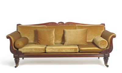 Lot 1705 - A Carved Mahogany Settee, circa 1840, upholstered in gold velvet dralon with squab cushions between