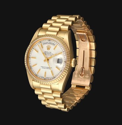 Lot 2170 - An 18 Carat Gold Automatic Day/Date Centre Seconds Wristwatch, signed Rolex, Oyster Perpetual,...