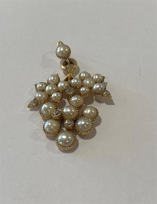 Lot 2185 - A Split Pearl and Diamond Pendant, realistically modelled as a bunch of grapes, set throughout with